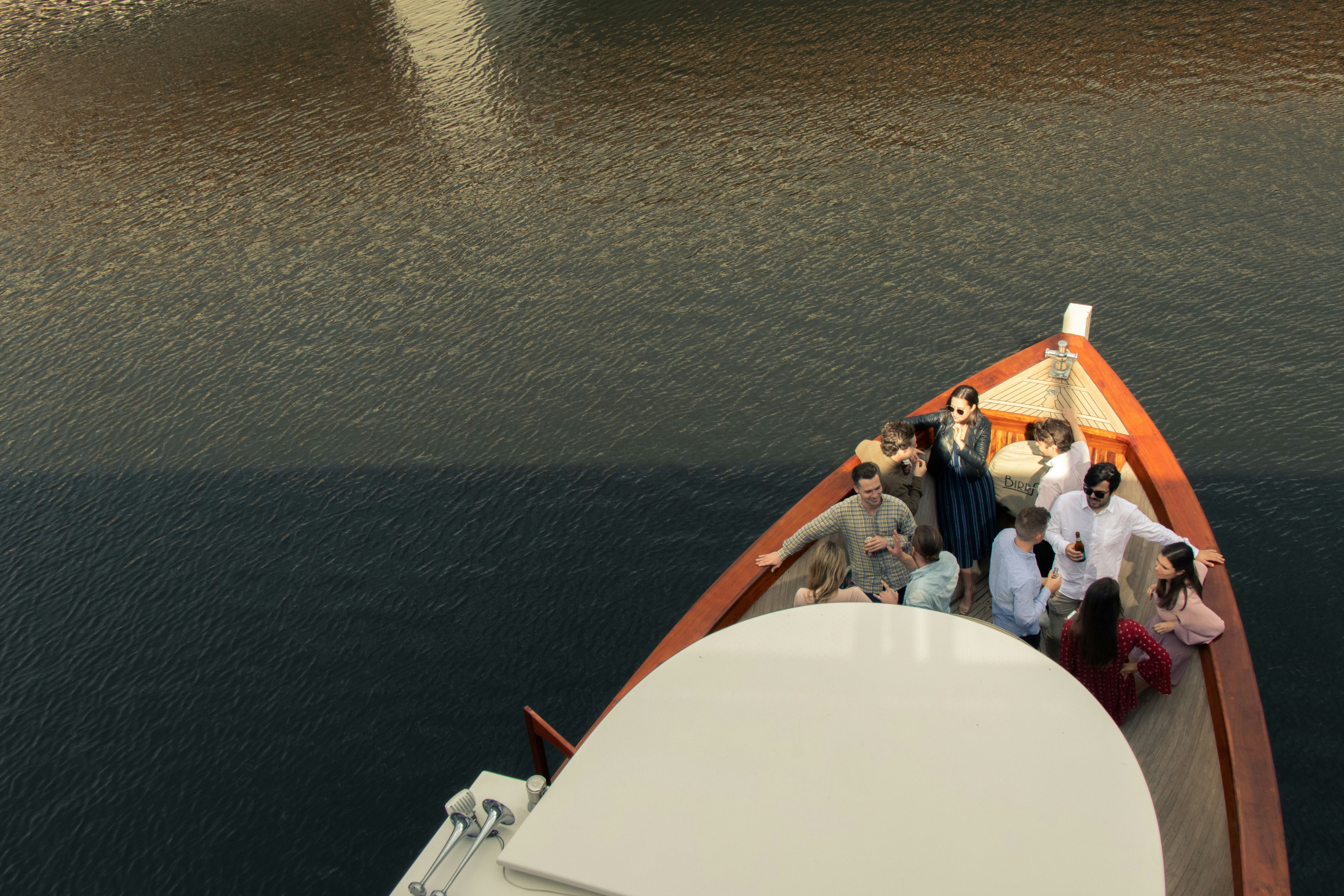 people on beige sailboat